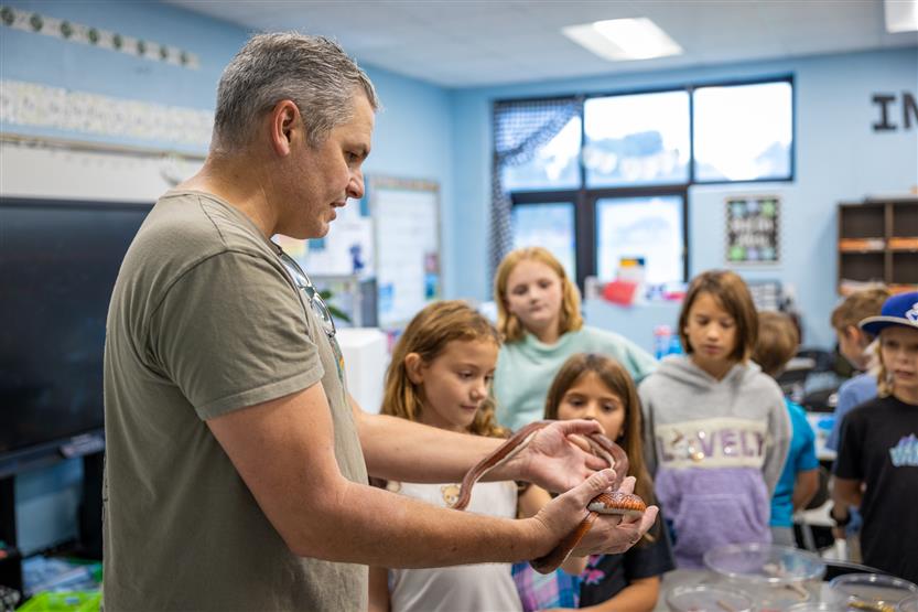 Students study reptiles